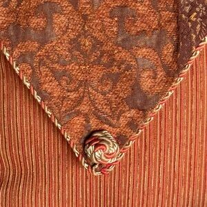 2 Decorative Burnt Orange & Rust Tassel Accent Fabric pillows.